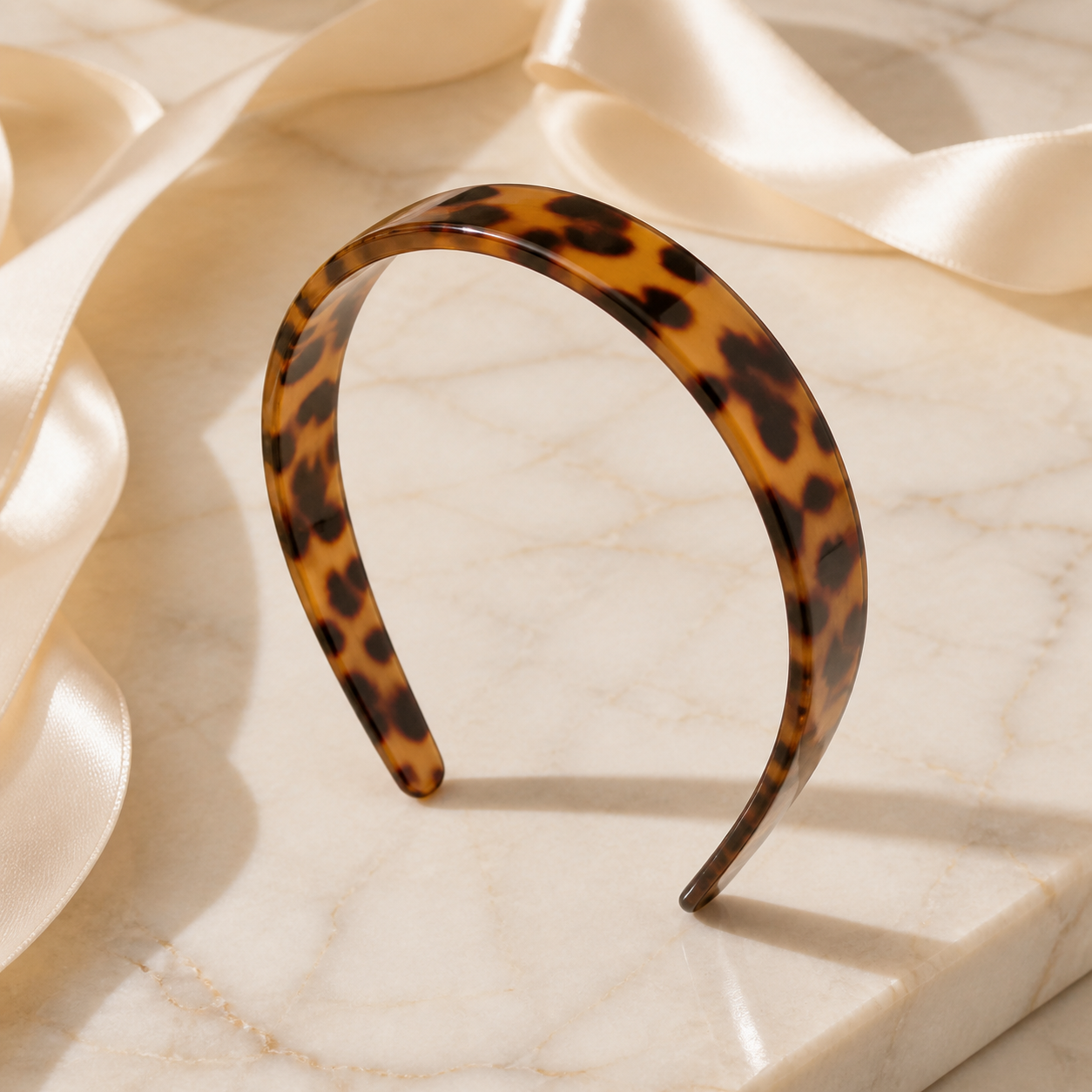 Tortoise acetate headband on ivory marble